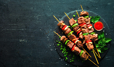 Grilled meat and vegetables on skewers