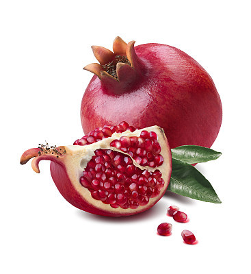 Pomegranate whole and quarter piece isolated on white background