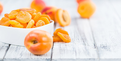 Dried Apricots (selective focus) on vintage wooden background