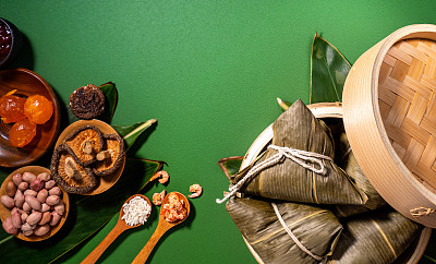 Close up, copy space, top view, flat lay. Famous asian chinese tasty handmade food in duan wu festival, steamed rice dumplings shaped like pyramidal ingredients