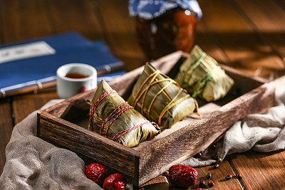 duanwu festival rice dumplings and rice wine on wooden plate