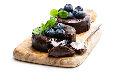 Chocolate fondant with blueberry isolated on white