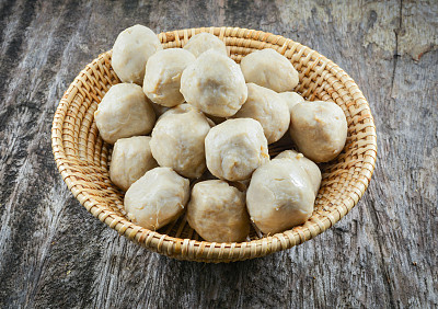 Meat balls thai in cup basket on wooden background / pork ball