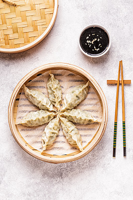Asian dumplings, soy sauce, chopsticks