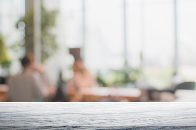 Stone table top and blurred restaurant interior background