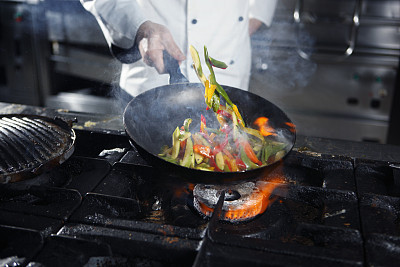 Chef cooking vegetables