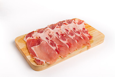 Fresh pork sliced in white wooden plate isolate onwhite background with clipping path
