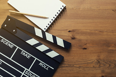 movie clapper on wood table