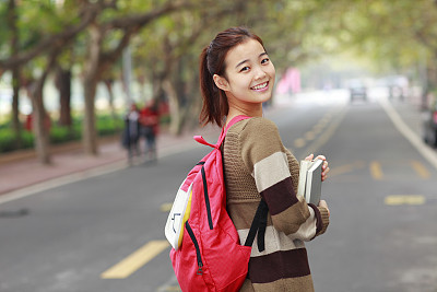 lovely asian college student in campus