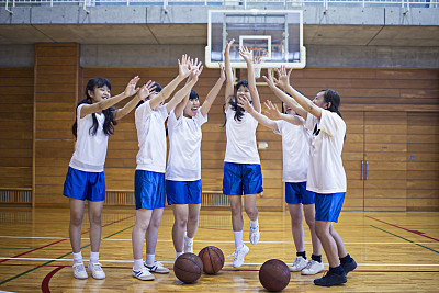 Japanese basketball girls team happy after playing