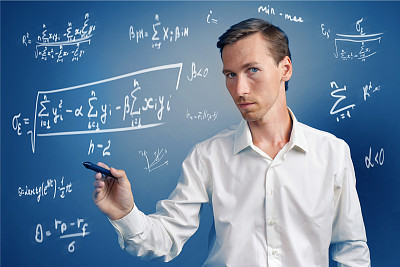Man scientist or student working with various high school maths and science formulas