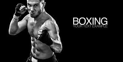 Sportsman muay thai boxer fighting in boxing cage. Isolated on black background with smoke. Copy Space. Black and white photo. Sport concept.