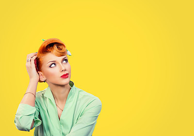 Thinking girl. Portrait closeup funny confused skeptical woman girl female thinking trying to recall looking upwards isolated yellow wall background. Human expressions emotions feelings body language