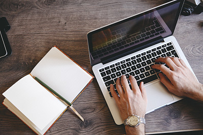 writing on a laptop