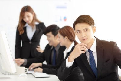 young business man  with colleagues on background