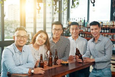 Cheerful colleagues in pub