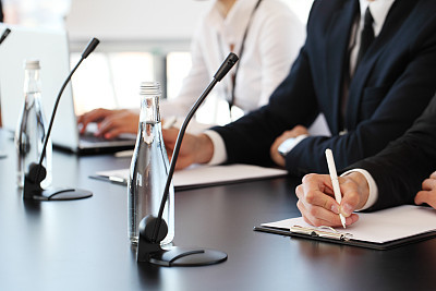 Speakers at business meeting