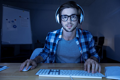 Handsome nice man wearing headphones