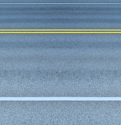 Asphalt road and double yellow lines dividing the lanes, at night