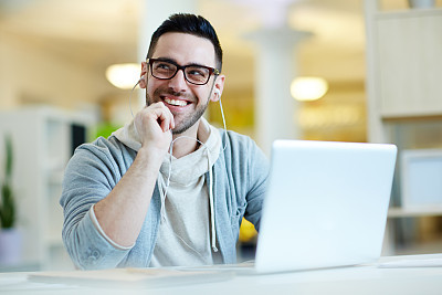 Smiling Adult Man Listening to Music