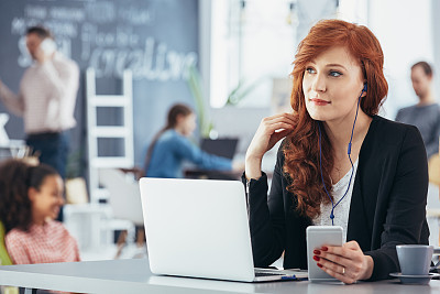 Woman listening music while working