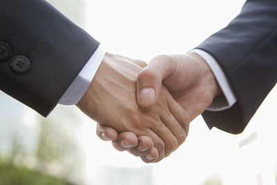 Businessman handshaking after partnership meeting
