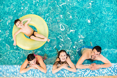 Family in the swimming pool