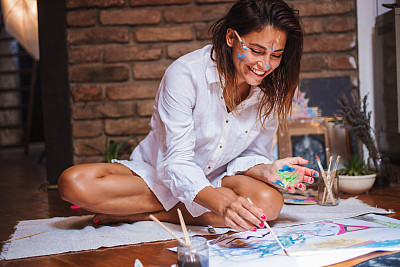 Beautiful artist enjoying her work
