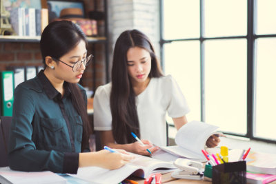 Asian groups are brainstorming, working in the office, reviewing lessons, doing homework in the university, group concept.
