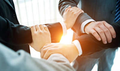 Business people hands locked