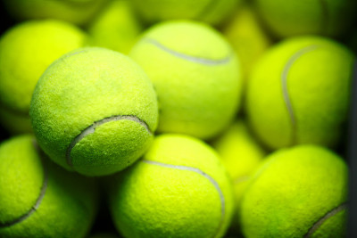 Lots of vibrant tennis yellow balls