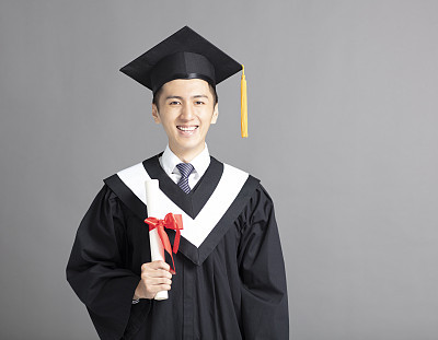 Cheerful young graduated student man isolated