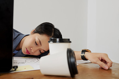 Overworked businesswoman at office