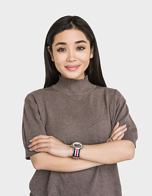 Portrait of a happy young woman with crossed arms