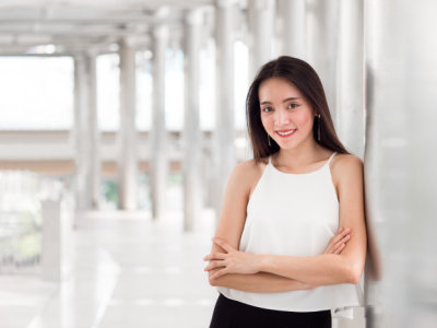 Portrait young beautiful asian business woman on city background.