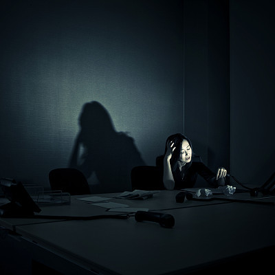 stressed businesswoman alone in her office
