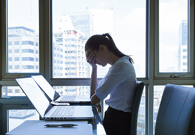 Stressed young businesswoman