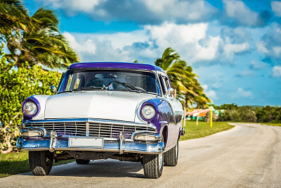 HDR - American blue vintage car parked on the Malecon near the beach in Havana Cuba - Serie Cuba Reportage