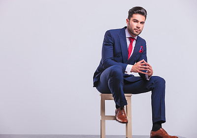 elegant businessman sitting on chair