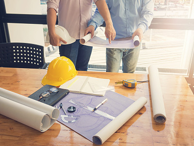 Architect concept, Architects working with blueprints in the office, Vintage Effect