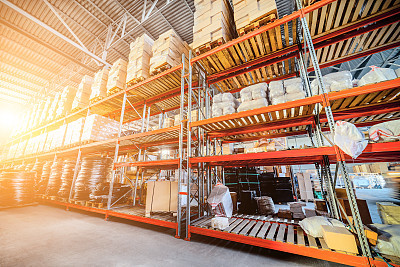 Long shelves with a variety of boxes and containers.