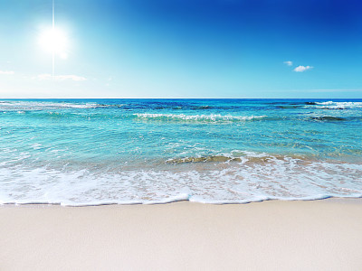 Beach scene showing sand, sea and sky