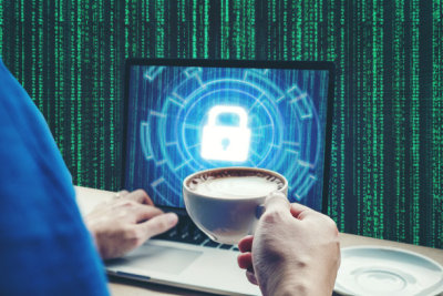 Businessman hand using laptop with Cyber security job business and  network server concept