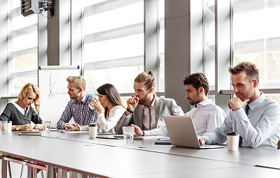 Business team collaborating in board room