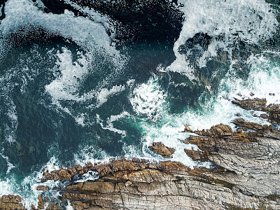High angle view of the waves crashing against the sea