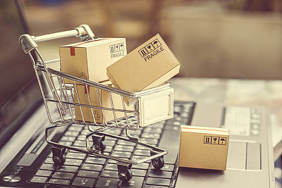Paper boxes in a shopping cart.