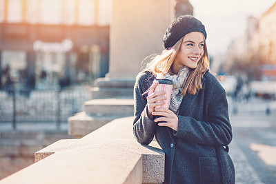 Enjoying the sunlight with a cup of coffee