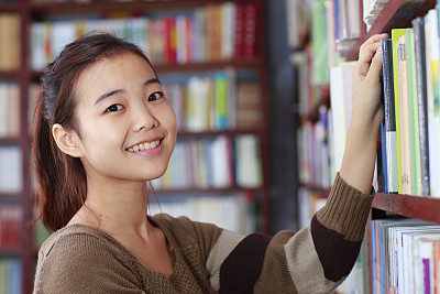 pretty college student in library