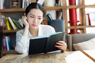 girl in the  bookstore  reading