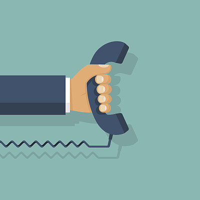 Handset in hand. Holding telephone